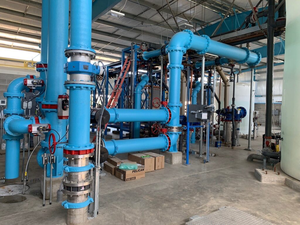 A large industrial building with pipes and valves.