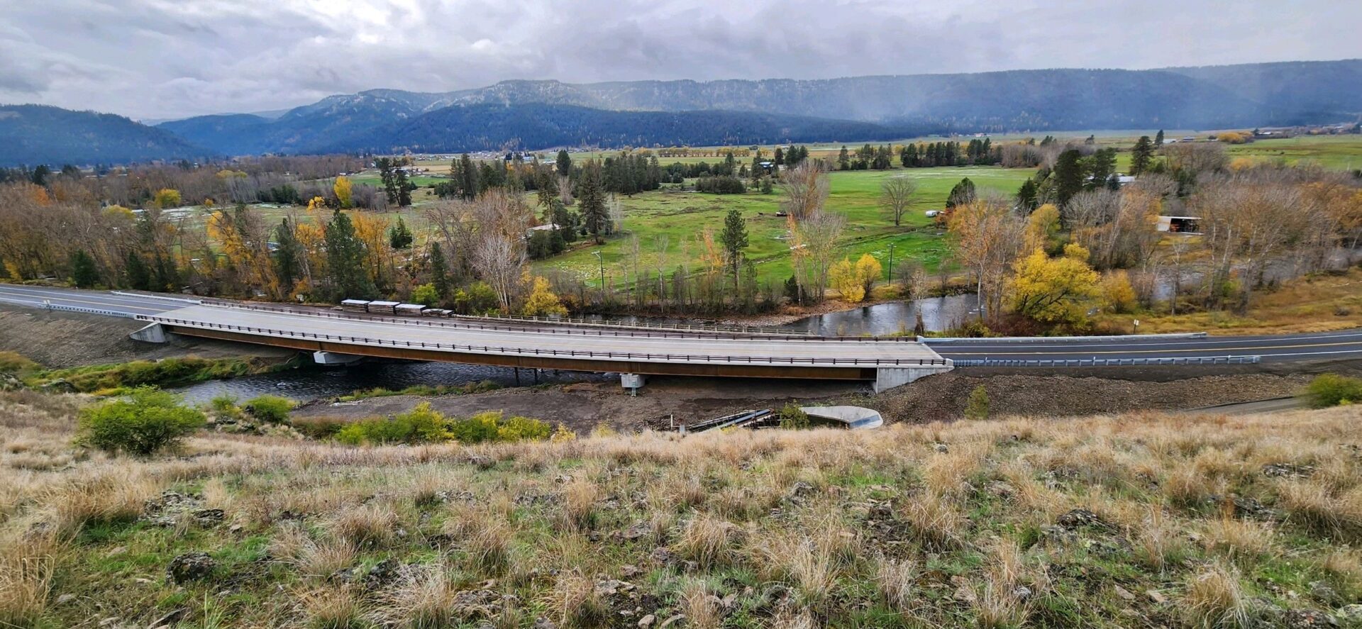 Top view of a bridge on the highway along with trees