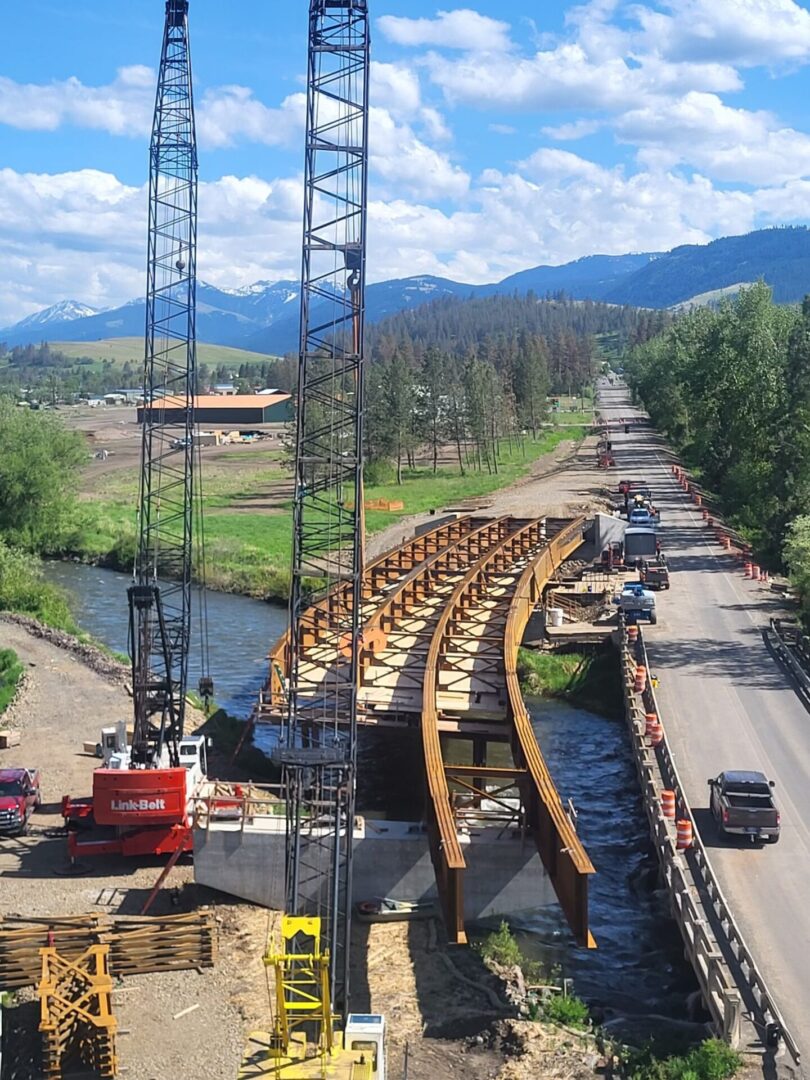 Top view of an under construction bridge with some machines